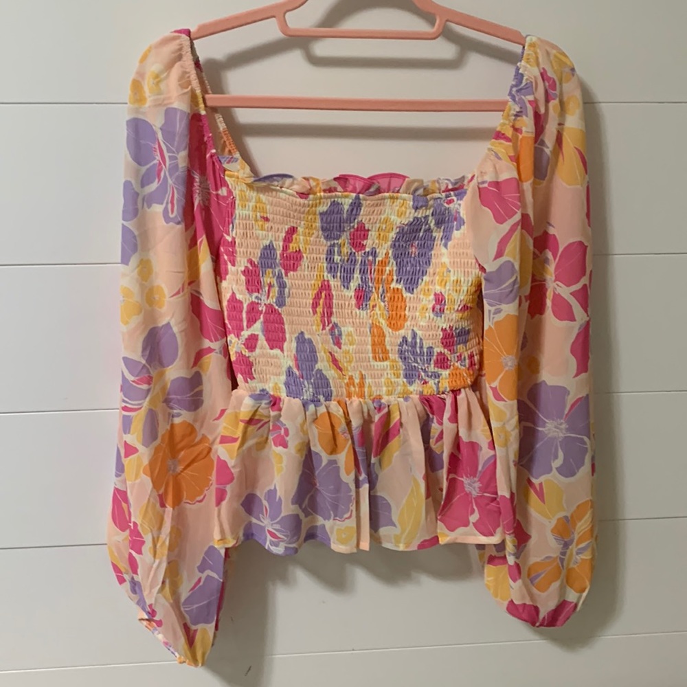 Floral print smocked long sleeve peplum blouse; size Small